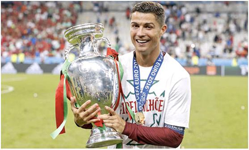 Cristiano ROnaldo holding the EURO 2016 trophy