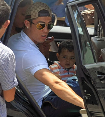 Cristiano Ronaldo protecting his son, Ronaldo Jr.