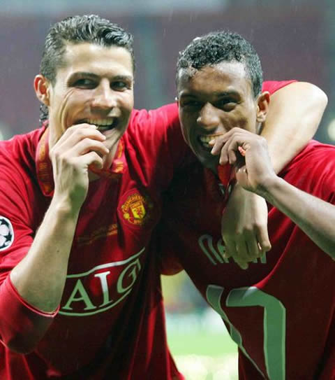 Nani and Cristiano Ronaldo biting their UEFA Champions League medals in Manchester United