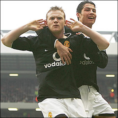 Wayne Rooney and Cristiano Ronaldo celebrating a goal, with Rooney pretending to be depht