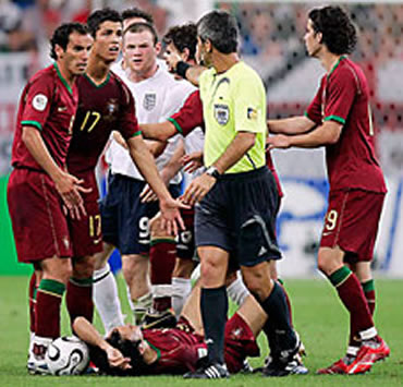 Cristiano Ronaldo calling the referee's attention to look at what Rooney had just did in England vs Portugal clash, in Germany's 2006 World Cup