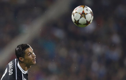 Cristiano Ronaldo heading a UEFA Champions League match ball