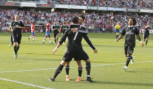 Cristiano Ronaldo being hugged by Isco, in Granada vs Real Madrid for La Liga