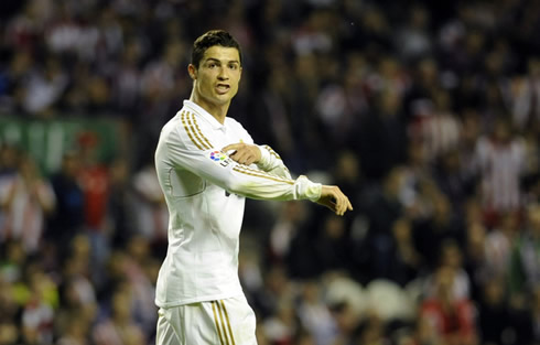 Cristiano Ronaldo celebrates La Liga title pointing to the Spanish League LFP badge in Real Madrid jersey, in 2012