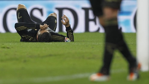 Cristiano Ronaldo layed down with his hand on his head