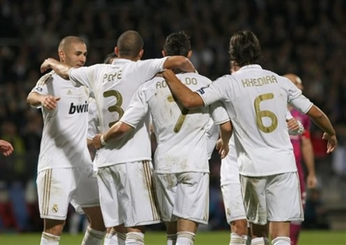 Benzema joins a group hug from Pepe, Cristiano Ronaldo and Khedira