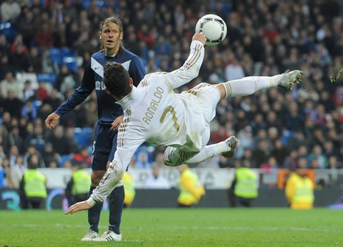 Cristiano Ronaldo amazing acrobatic side shot, with Demichelis looking mesmerized with the movement, in Real Madrid vs Malaga for the Copa del Rey, in 2012