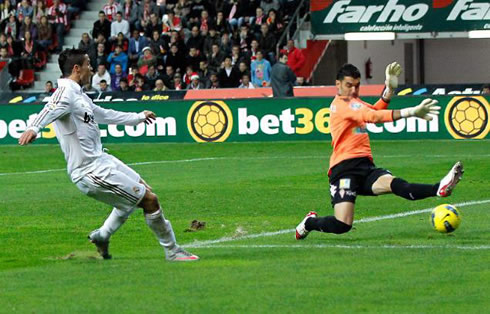 Cristiano Ronaldo scoring a goal against Sporting Gijón
