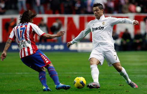 Cristiano Ronaldo dribbling a Sporting Gijón defender