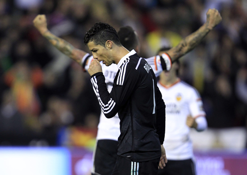 Cristiano Ronaldo scratching his nose after Valencia scored a goal against Real Madrid