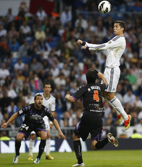 Cristiano Ronaldo elevating quite high in the air, to head a ball and score a goal for Real Madrid, in the Spanish League 2013 campaign