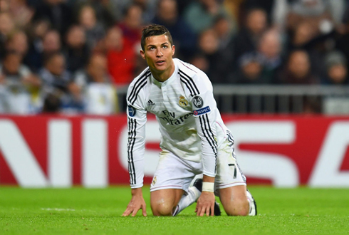 Cristiano Ronaldo on his knees and about to stand up