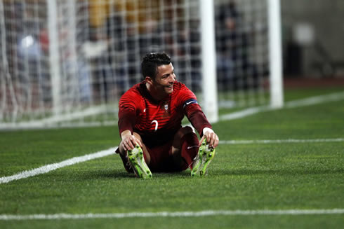 Cristiano Ronaldo stretching his legs during a game between Portugal and Cameroon