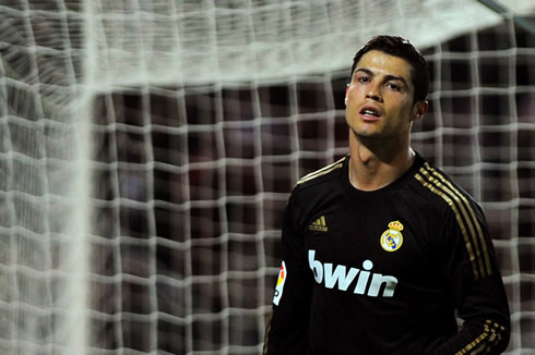 Cristiano Ronaldo unhappy reaction face in a Real Madrid black jersey in 2012