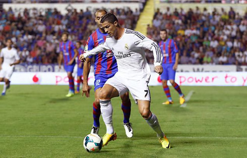 Cristiano Ronaldo holding off a defender on his back by using his arms