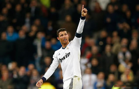 Cristiano Ronaldo raising and pointing his finger up, to dedicate his goal to his son and his girlfriend on the stands