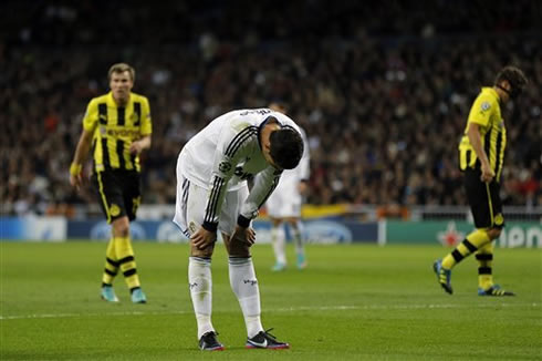 Cristiano Ronaldo looks down and puts his hands on his knees, in Real Madrid vs Borussia Dortmund, for the Champions League 2012-2013