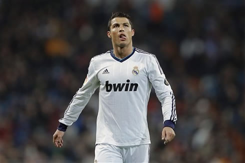 Cristiano Ronaldo licking his lips with his tongue, as he heads back to Real Madrid half, in the Copa del Rey 2013