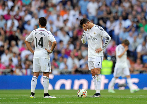 Cristiano Ronaldo ashamed and covering his face with his right hand