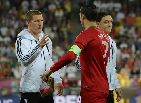 Cristiano Ronaldo greeting Mesut Ozil and Bastian Schweinsteiger, in Portugal vs Germany for the EURO 2012