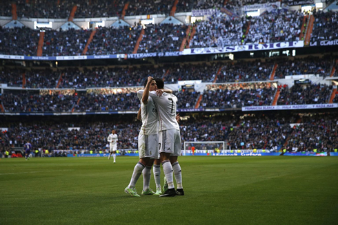 Cristiano Ronaldo hugs James Rodríguez in a full packed Santiago Bernabéu