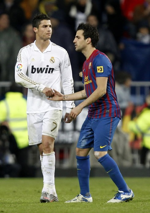 Cristiano Ronaldo salutes Barcelona's Cesc Fabregas in the Clasico