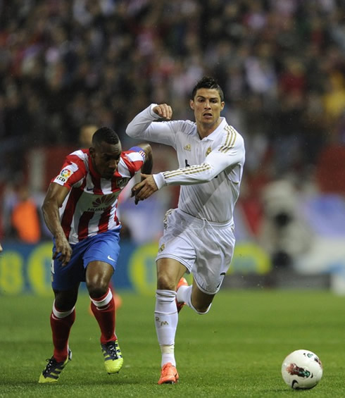 Cristiano Ronaldo running side by side with Perea, in Atletico Madrid vs Real Madrid for La Liga 2012