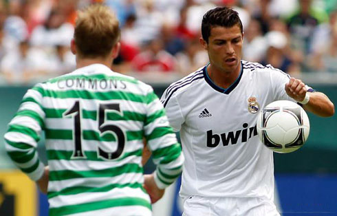 Cristiano Ronaldo staring the ball, as he looks to control it during a game between Real Madrid and Celtic in 2012