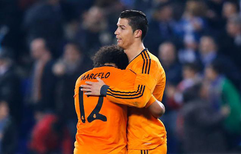 Cristiano Ronaldo comforting Marcelo with a hug, in Real Madrid 2014