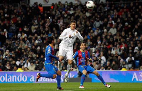 Cristiano Ronaldo jumping in the air and preparing to head the ball in Real Madrid vs Levante in 2012
