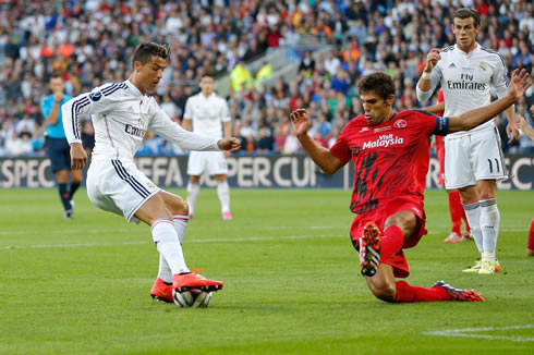 Cristiano Ronaldo sitting down a defender, in a Real Madrid vs Sevilla final, in the UEFA Super Cup 2014