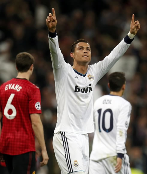 Cristiano Ronaldo raising his two arms towards his family in the Santiago Bernabéu stands, after scoring the equaliser goal for Real Madrid, against Manchester United, in 2013