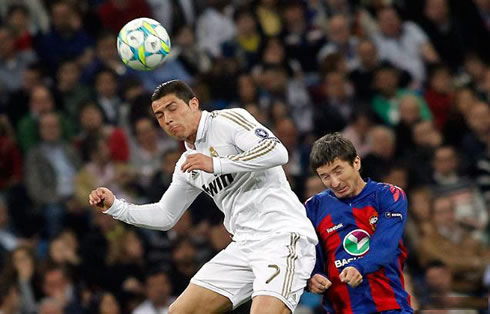 Cristiano Ronaldo heading the ball in the air with his eyes closed