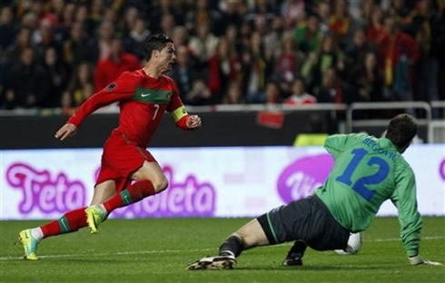 Cristiano Ronaldo dribbling and getting past Bosnia's goalkeeper