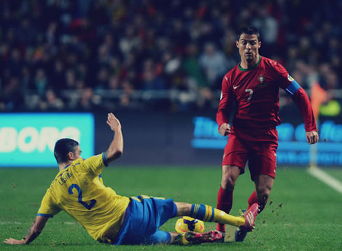 Cristiano Ronaldo being tackled on a game for Portugal against Sweden