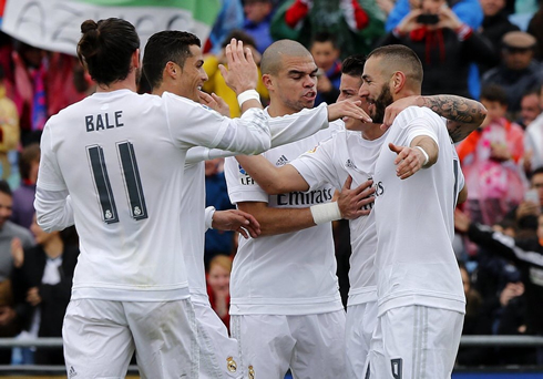 Real Madrid players celebrating James Rodríguez goal by hugging each other