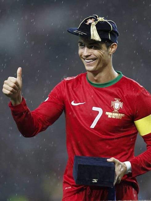 Cristiano Ronaldo wearing a very nice and funny hat given by the Portuguese Football Federation, to celebrate his 100th cap for Portugal, in 2012