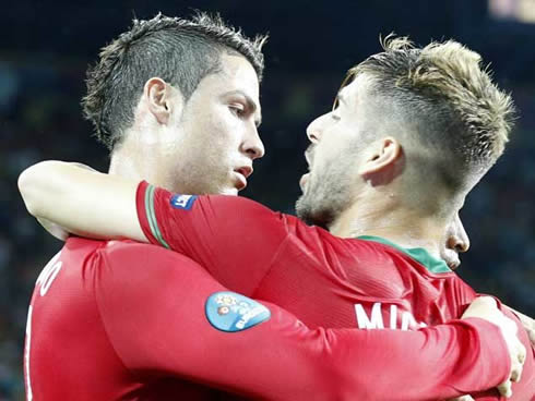 Cristiano Ronaldo almost kissing Miguel Veloso, in a somehow football/soccer gay moment at the EURO 2012