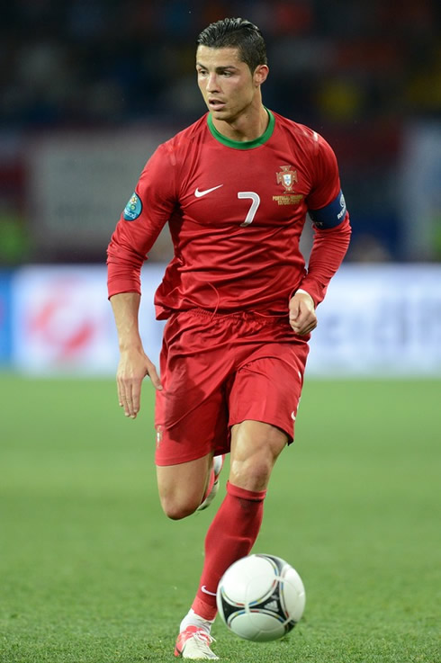 Cristiano Ronaldo running with the ball with looking at it, in Portugal vs Holland in the EURO 2012