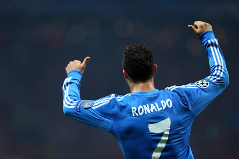 Cristiano Ronaldo raises his two thumbs as a sign of approval to his teammates in Real Madrid