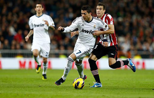 Cristiano Ronaldo being pulled by his shirt from behind, in Real Madrid vs Athletic Bilbao in 2012-2013