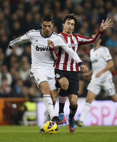 Cristiano Ronaldo body balance as he gets pushed by a defender, in Real Madrid 5-1 Athletic Bilbao, for La Liga 2012-2013