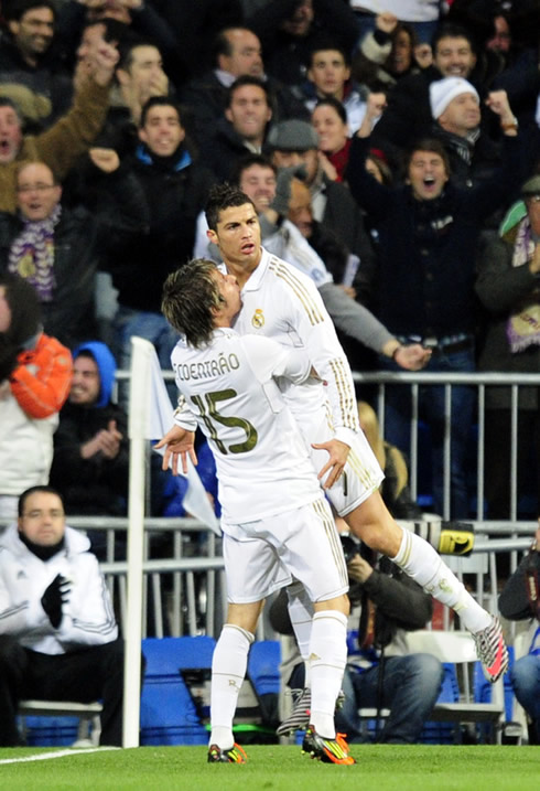 Cristiano Ronaldo allows Fábio Coentrão to raise him against his chest