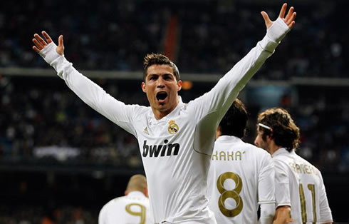 Cristiano Ronaldo interacts with the fans and supporters in the Santiago Bernabéu and raises his hands, after scoring a goal for Real Madrid, in the Spanish League 2012