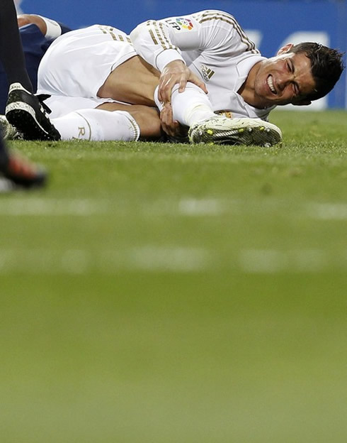 Cristiano Ronaldo hurt laying on the ground, in Real Madrid vs Malaga