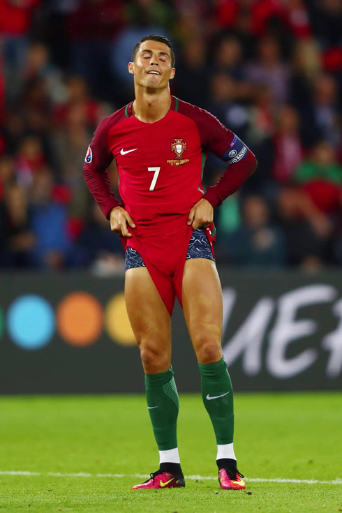 Cristiano Ronaldo pulling his shorts up and showing his legs, in Portugal vs Austria in the EURO 2016