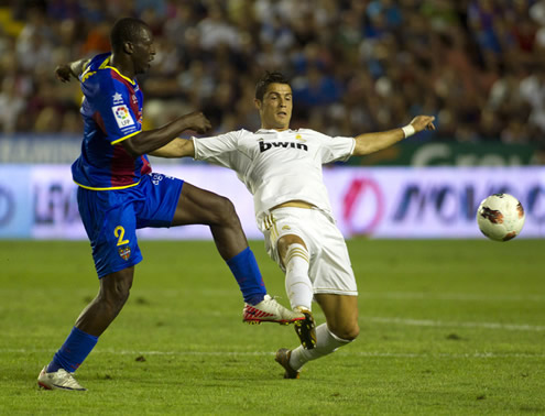 Cristiano Ronaldo attempting to tackle an opponent in La Liga 2011-12, in the match Real Madrid vs Levante
