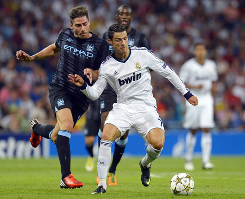 Cristiano Ronaldo holding Javi Garcia charge, in Real Madrid vs Manchester City, for the UEFA Champions League 2012-2013