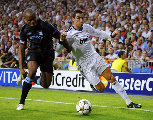 Cristiano Ronaldo fighting with Vincent Kompany for the ball, in Real Madrid 3-2 Manchester City, for the UEFA Champions League in 2012-2013