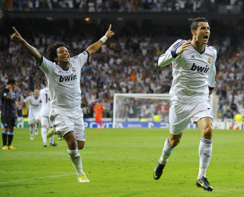 Cristiano Ronaldo and Marcelo running in the Bernabéu to celebrate Real Madrid victory over Manchester City, at the UEFA Champions League debut in 2012-2013